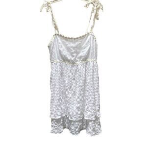 Crystal Doll size L tiered daisy trimmed mini dress.